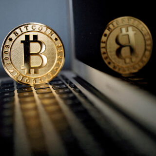 FILE PHOTO: Bitcoin representation is seen in an illustration picture taken at La Maison du Bitcoin in Paris