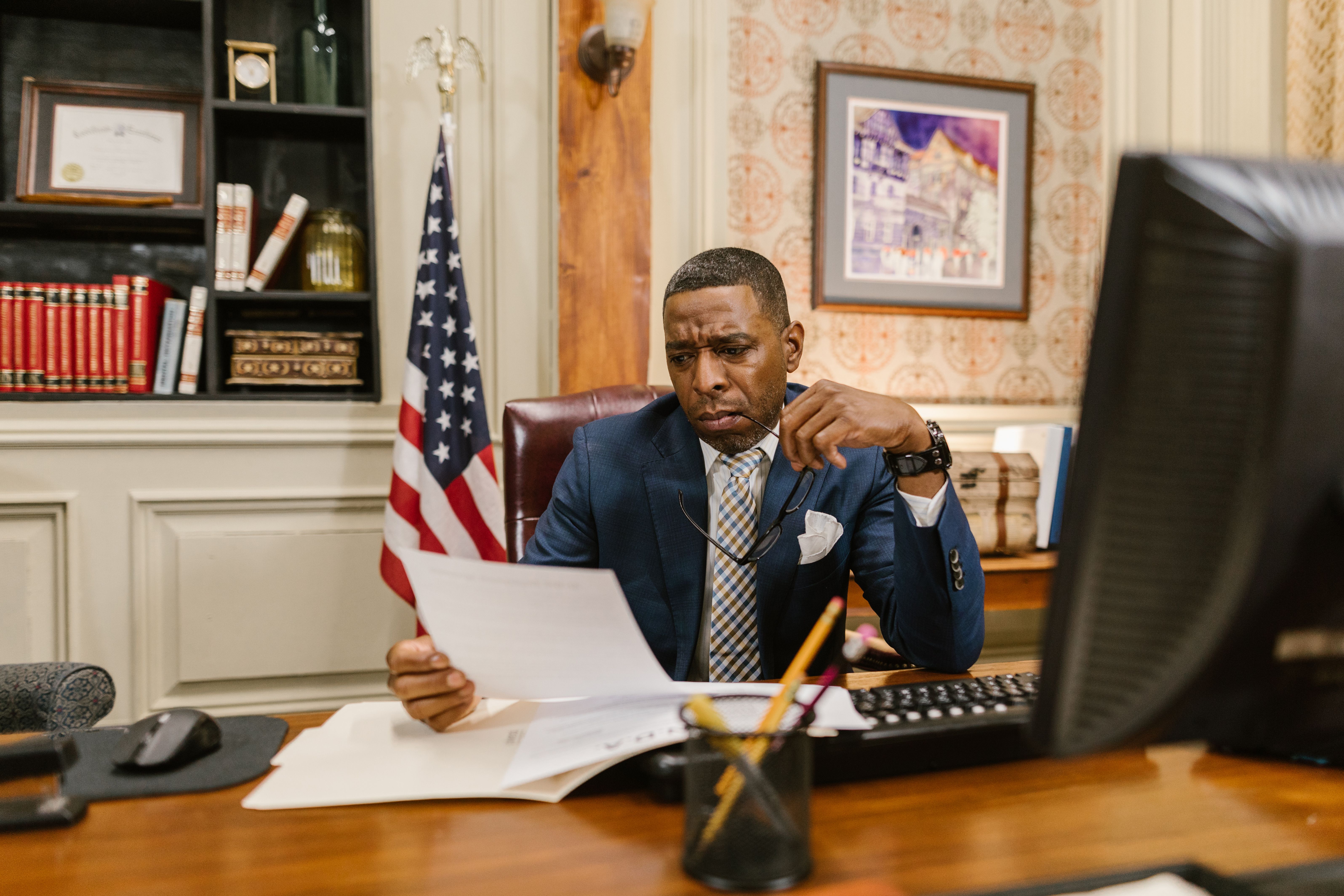 Lawyer carefully reviewing documents, representing independent investigation and scrutiny