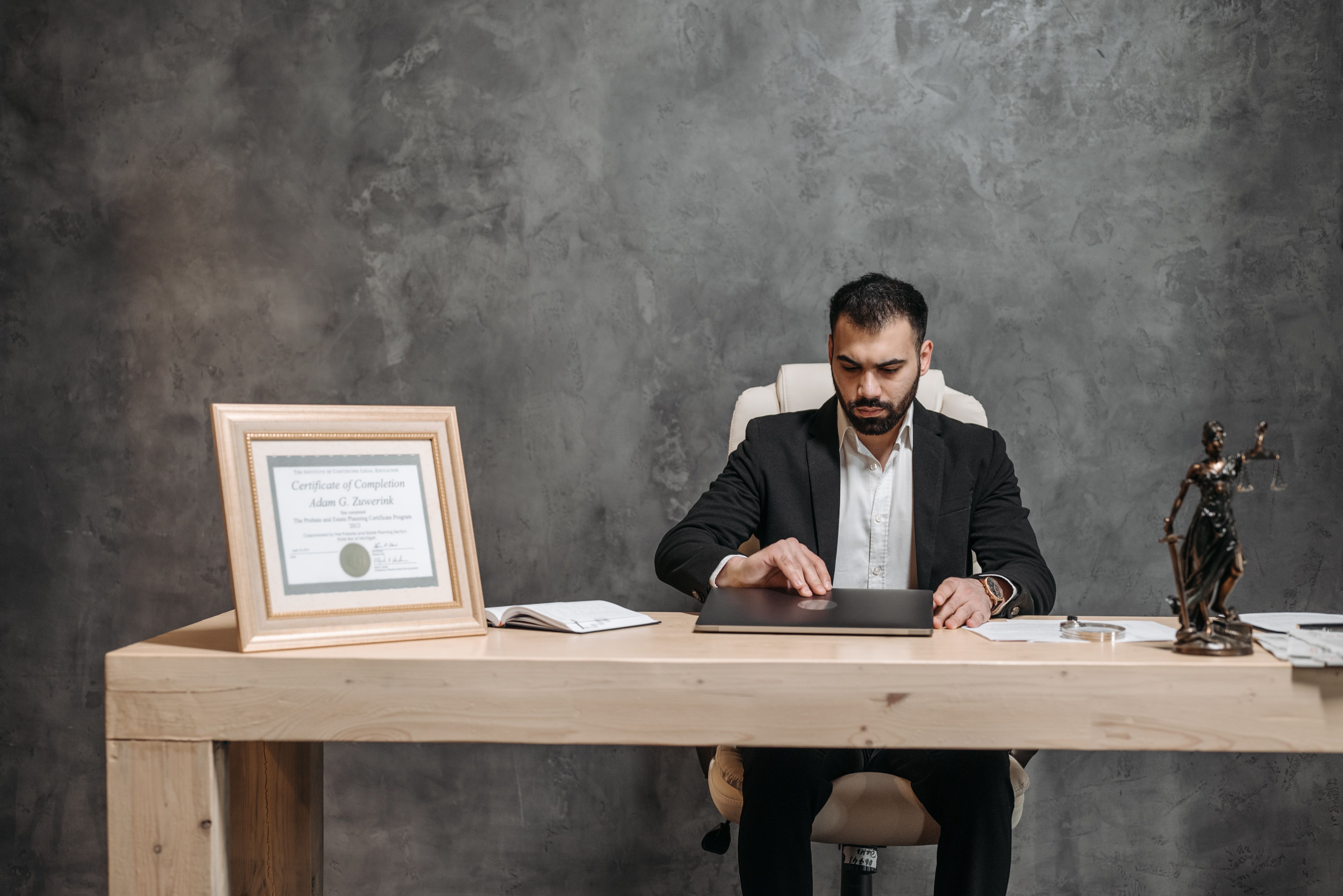 Lawyer working at his office desk reviewing case documents